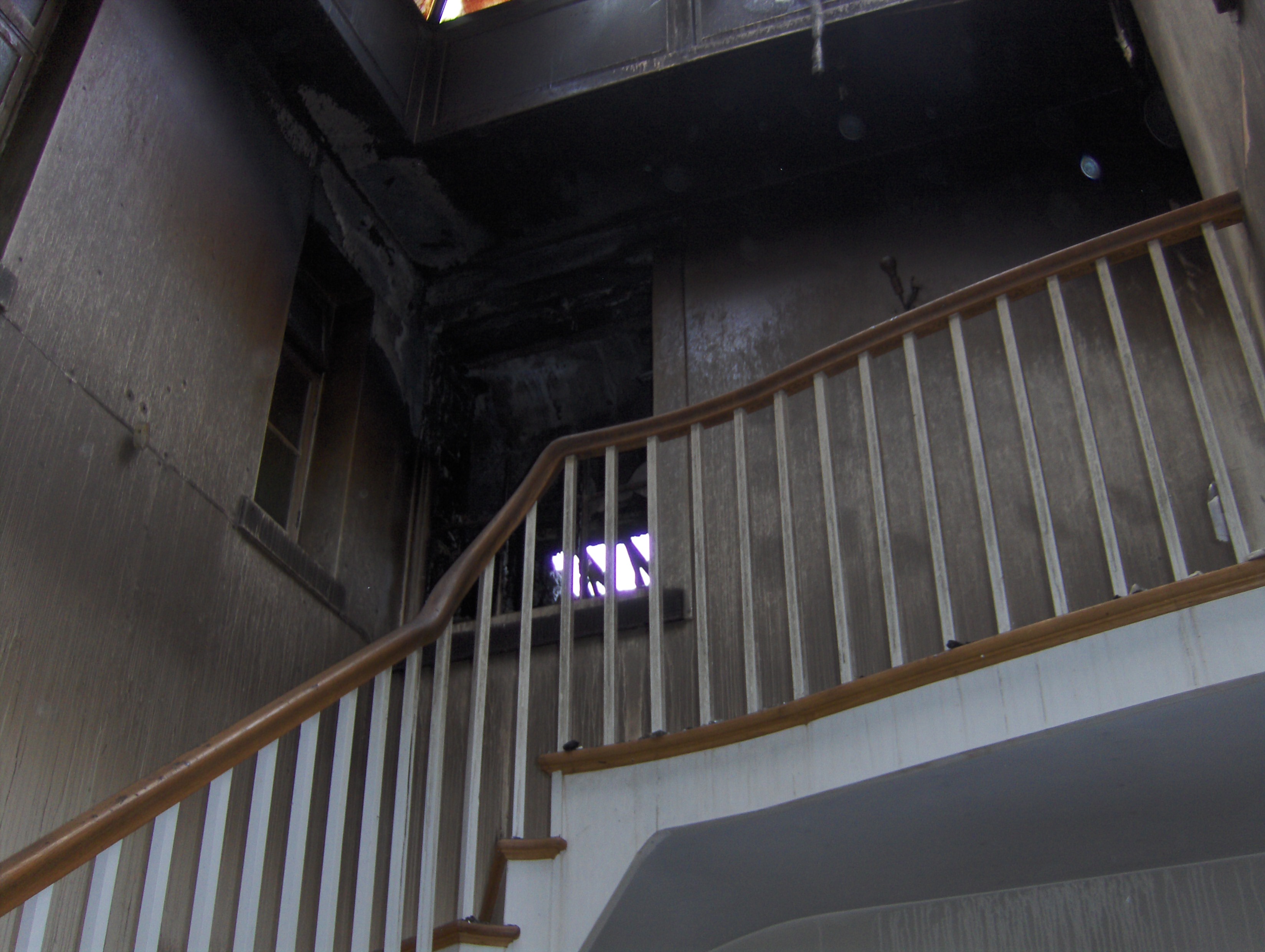 soot and smoke damage to staircase in property