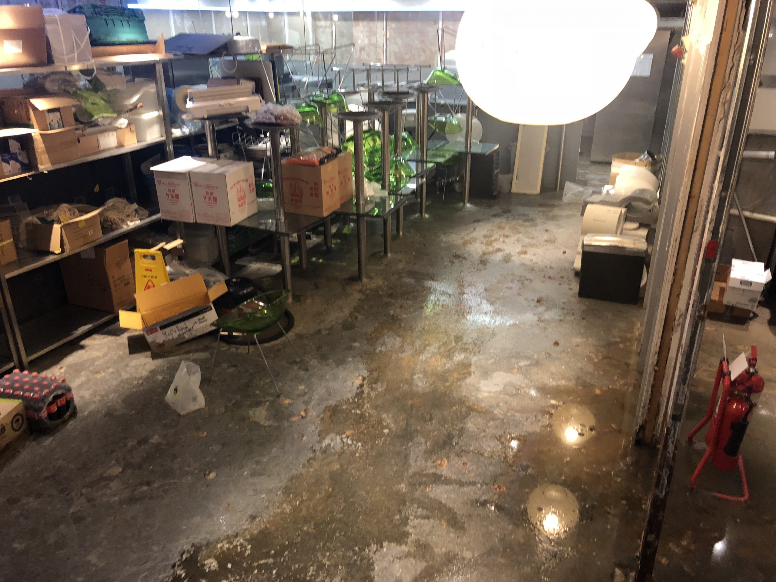 A stock room in a commercial property showing extensive sewage water damage.