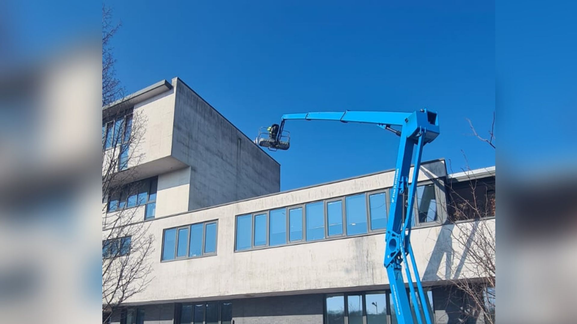 Stone Wall Cleaning Using Cherry Picker to help illustrate Vinci's stone cleaning services.