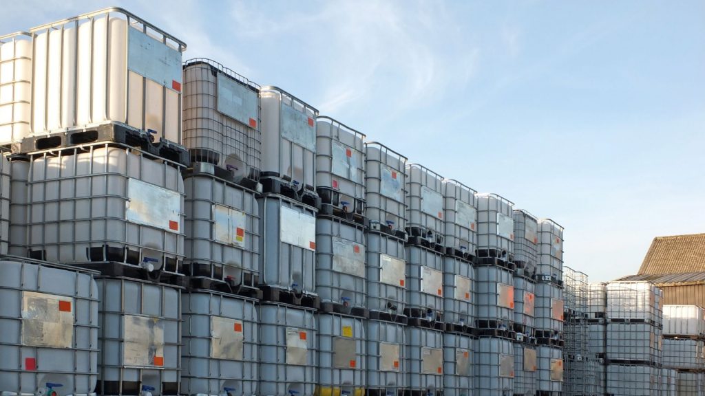 Intermediate Bulk Containers (IBC) stacked high.