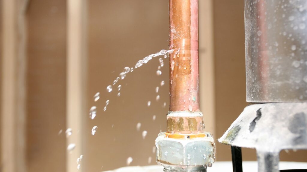 Water leaking out of a copper pipe