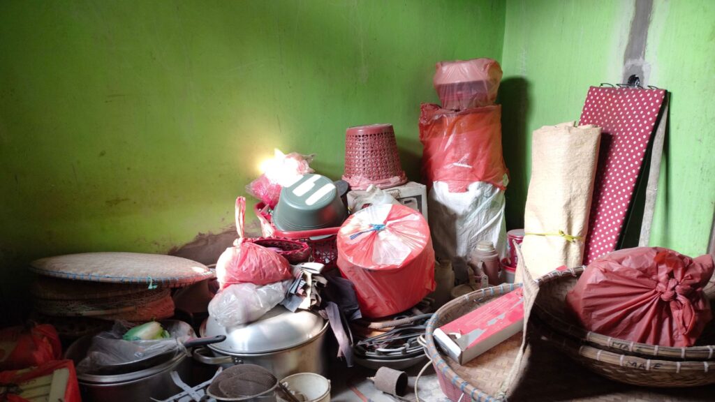 Bagged rubbish strewn across a room to illustrate a hoarder's house.