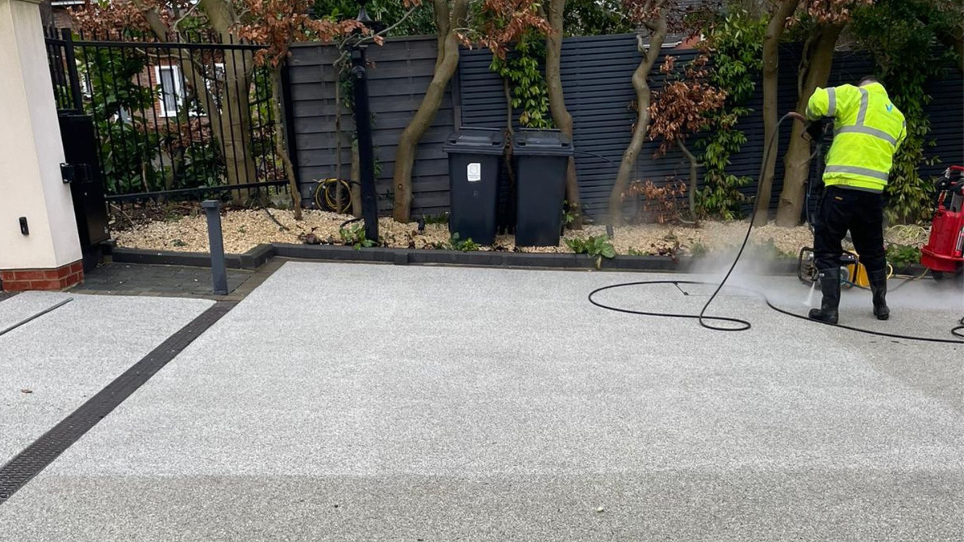 Vinci technician cleaning a stone driveway