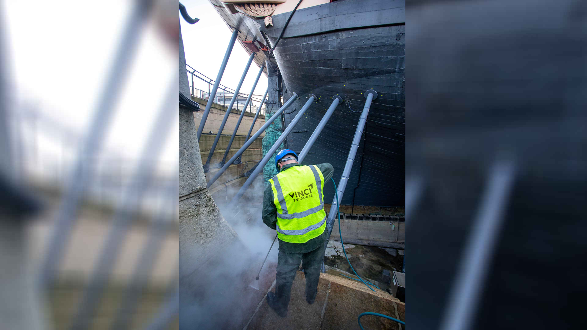 A Vinci Response technician cleaning a stone floor.
